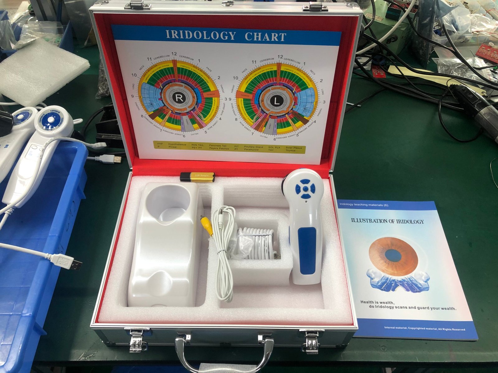 A professional iridology camera on a timber consultation desk next to a display monitor in South Africa
